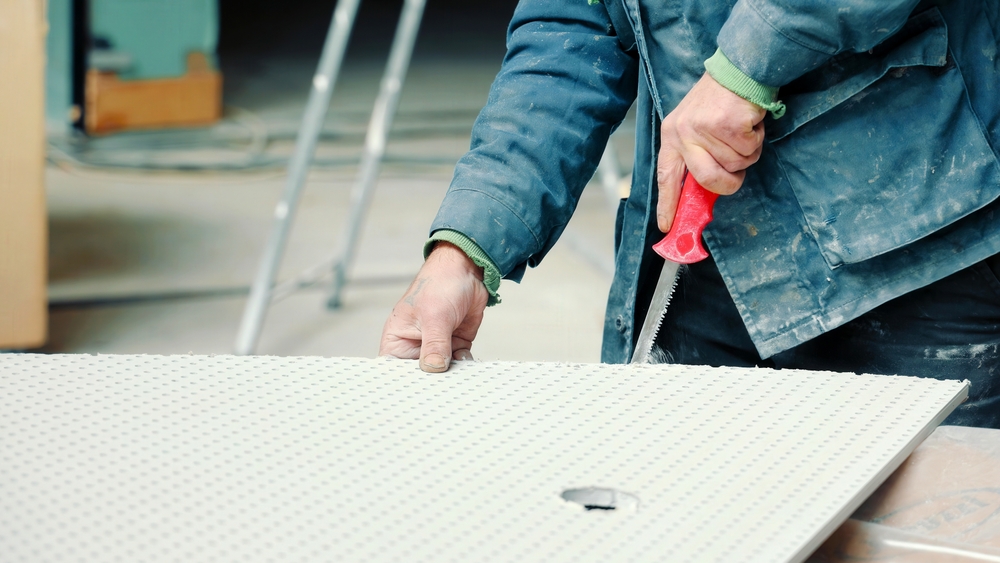 Insulation boards being cut with saw